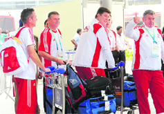 British athletes and team officials arrive to participate in the Commonwealth Games in New Delhi on Friday.