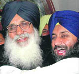 Punjab CM Parkash Singh Badal (L) with son Sukhbir Singh Badal.