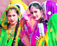 Artistes wait to perform at the Games village