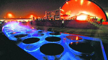 A view of the illuminated Commonwealth Games village on