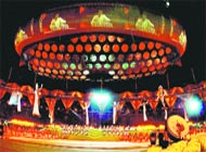 A tabla player is reflected in the aerostat.