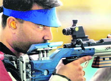 Gagan Narang takes aim during the final round of the mens singles 50m rifle 3 position event of the Commonwealth Games in New Delhi on Saturday. 