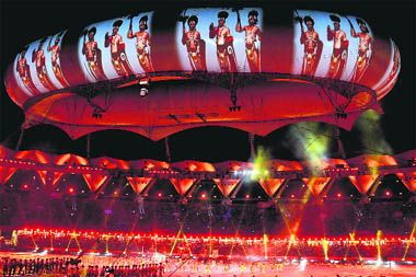 A martial arts show as reflected on the aerostat during the closing ceremony of XIX Commonwealth Games in New Delhi 