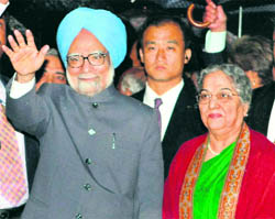 Prime Minister Manmohan Singh and his wife Gursharan Kaur upon their arrival at the Tokyo International Airport on Sunday.