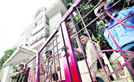 ITBP personnel stand guard outside the guesthouse of Karnataka Health Minister B Sreeramulu during the raid by income tax officials in Bangalore on Monday.