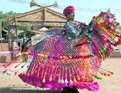 A Rajasthani folk dancer performs Kucchi Ghodi at Kalagram
