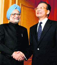 PM Manmohan Singh with Chinese Premier Wen Jiabao in Hanoi, on Friday.