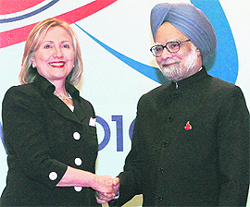 Prime Minister Manmohan Singh with US Secretary of State Hillary Clinton in Hanoi on Saturday. 