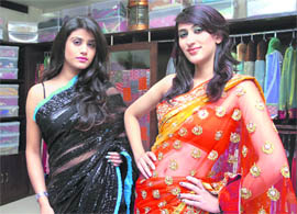 Models display designer festival collection at Pari’s in Manimajra on Monday. The collection includes bridal wear, cocktail sarees, suit and formal wear.