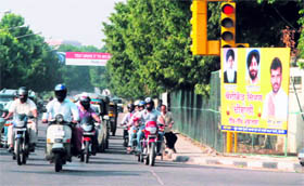 Mohali district planning board chairman NK Sharma has erected hoardings across the town to wish Divali to residents allegedly without seeking permission. At many places, hoardings have been fixed adjacent to paid advertisements.