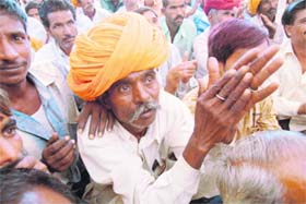 A villager watches US President Barack Obamas interaction with farmers through video conferencing at Kanpura in Ajmer
