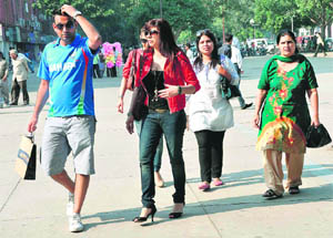 Tourists enjoy a stroll at the Sector-17 piazza on a bright Tuesday morning.