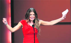 Singer Fergie speaks after winning the Woman of the Year award at the 20th annual Glamour Magazine Women of the Year award ceremony in New York on Monday.
