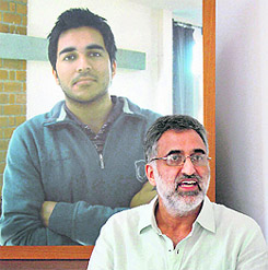 Rajinder Kachroo stands in front of his son Amans photo