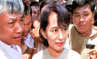Aung San Suu Kyi is mobbed by supporters as she arrives at the headquarters of her National League for Democracy in Yangon