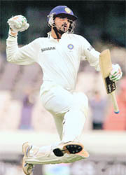 Harbhajan Singh jubilates after completing his century on the fourth day of the second Test against New Zealand in Hyderabad on Monday.