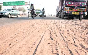 Sand strewn on the Ambala-Chandigarh highway near the Zirakpur flyover