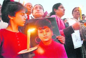 Family members and NGO activists hold a candlelight vigil seeking justice for Ruchika at the Sector-17 Plaza in Chandigarh