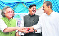Environment Minister Jairam Ramesh, Civil Aviation Minister Praful Patel and Maharashtra Chief Minister Prithviraj Chavan during the joint media conference at Maharashtra Sadan in New Delhi.