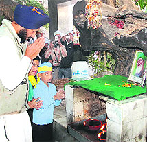 Manpreet Singh Badal pays obeisance at Tilla Baba Farid before starting his Jago Punjab Yatra in Faridkot on Wednesday. 