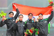 Indias victorious womens 4X400 relay team after winning gold 