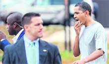 US President Barack Obama holds a piece of gauze to his lip after he was injured during a game of basketball with friends at Fort McNair in Washington DC on Friday. 