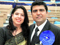 Charu Dutta, winner of the national award for best employee in disabled category, with his wife Amita.