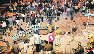 Ultras at it again: People look on as policemen and officials inspect the site of the explosion in Varanasi on Tuesday evening