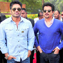 Bollywood actors Anil Kapoor (R) and Sunil Shetty during a programme organised by Plan India in New Delhi on Monday