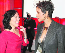 Actor Halle Berry (R) speaks with Janice Min, editorial director of The Hollywood Reporter, at The Hollywood Reporter Power 100 Women in Entertainment breakfast in Beverly Hills recently.