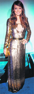 Cast member Olivia Wilde poses at the world premiere of the film TRON: Legacy in Hollywood, California.