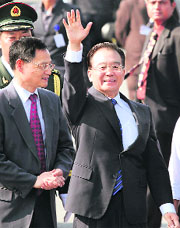 Chinese Premier Wen Jiabao waves on his arrival at Palam Air Force Station in Delhi on Wednesday.