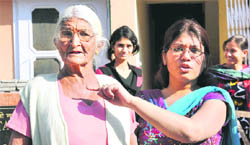 The granddaughter of 80-year-old Krishna shows injuries received by the former on the neck after her necklace was snatched at Sector 22 in Chandigarh earlier this month.