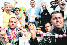 Bhartya Yuva Morcha members protest against the hike in the prices of onion at Sector 26 in Chandigarh on Wednesday.