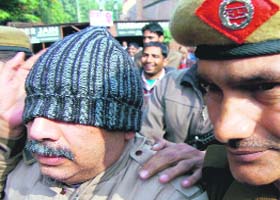 Hero group CFO Sanjay Gupta being taken to the court in Gurgaon