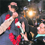 Taseers assassin Malik Hussain Qadri being garlanded outside a Pak court 
