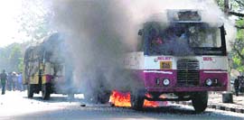 Buses being burnt on the Osmania University campus in Hyderabad on Thursday. 