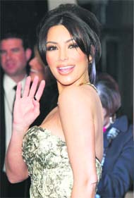 Reality TV star Kim Kardashian poses after winning the favourite guilty pleasure award for 'Keeping Up with the Kardashians' at the 2011 People's Choice Awards in Los Angeles.