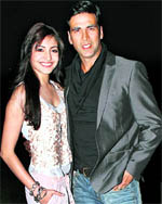 Bollywood actors Akshay Kumar and Anushka Sharma pose for photographers during the music release of their forthcoming film Patiala House in Mumbai on Sunday