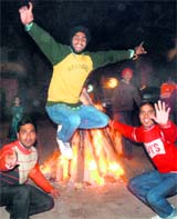 Youngsters celebrate Lohri in Sector 29, Chandigarh, on Thursday.