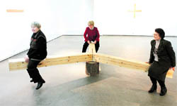 Women try an installation called Triple balance by French artist Fabrice Hybert at his exhibition at the Museum of Modern Art in Krasnoyarsk, Siberia, recently