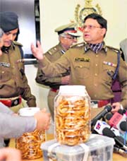 Delhi Police Commissioner Brijesh Gupta displays the jewellery recovered from the accused in New Delhi on Sunday.