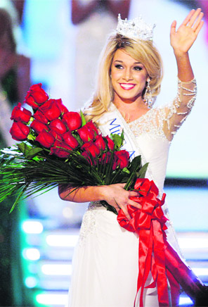 Miss Nebraska Teresa Scanlan, 17, waves after being crowned Miss America 2011 during the Miss America Pageant at the Planet Hollywood Resort and Casino in Las Vegas, on Sunday.