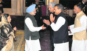 President Pratibha Patil and Prime Minister Manmohan Singh greet ministers after the swearing-in ceremony in New Delhi on Wednesday.