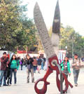 Visitors admire an art work at India Art Summit in New Delhi. 