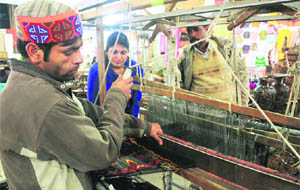 A master craftsman from Kullu shows his skills during live demonstration of Kullu Shawls at Kullu Festival at Lala Lajpat Rai Bhawan - 15, Chandigarh on Sunday.