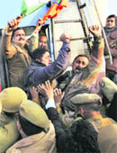 BJP workers shout slogans against the Jammu and Kashmir Government for stopping the partys top leaders at the airport in Jammu