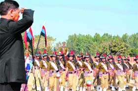 Garhwal Division Commissioner Ajay Singh Nambiyal takes the salute of the Uttarakhand women police contingent at Roshanabad on Republic Day in Haridwar