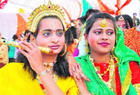 Two girls dressed as Radha and Krishna at a cultural function on Republic Day in Haridwar