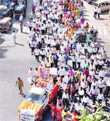 Government employees take part in a march protesting brutal killing of Malegaon Additional Collector Yashwant Sonavane, near Mumbai on Thursday. 